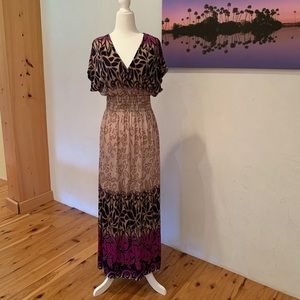 Long silk/polyester dress. Tag says XXL but I’m a two and it fits me well.